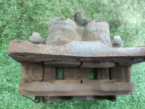 Суппорт передний левый под диск 295 мм SUBARU EXIGA YAM 2012